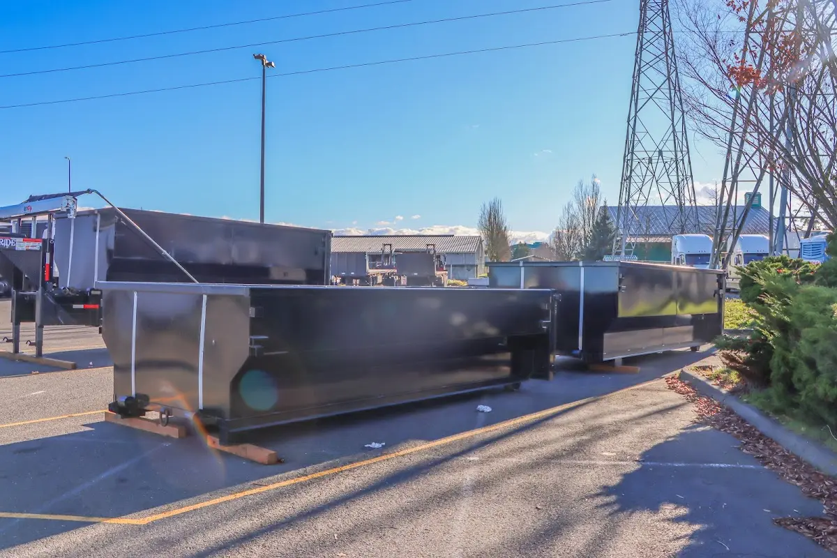 Roll-off dumpster ready for waste disposal at job site for Demolition Dumpster Rental in Swannanoa